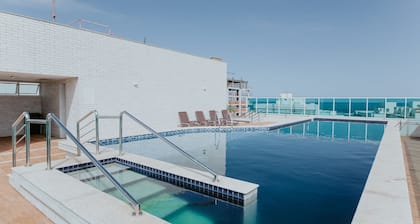 2-bedroom apartment in Enseada Azul with rooftop pool and barbecue