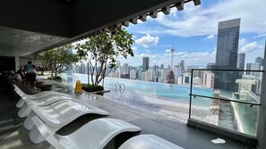 A rooftop pool with a cityscape view, including a prominent tower. - Rare Cityscape Stay in Bukit Bintang, TRX | 1-6pax (Kuala Lumpur)