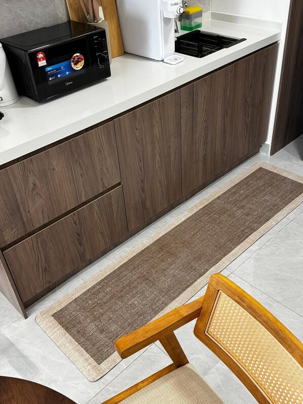 A kitchen with a built-in microwave, a coffee machine, and a sink. - Skyline & City Vibe in TRX, Bukit Bintang 1-5pax (Kuala Lumpur)