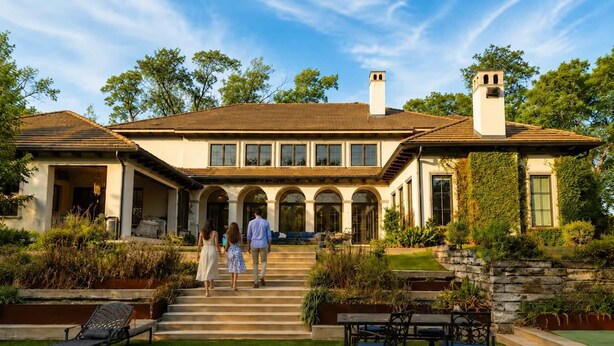 A large, two-story house with a covered front porch, a swimming pool, and a well-maintained garden. - Grand Luxury 11,000 sq ft Estate — 6BR, 8BA, Pool & Premium Finishes (Dallas)