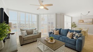A living room with two sofas, a coffee table, and a ceiling fan. - Seaspray Riverside 112 (Pensacola)