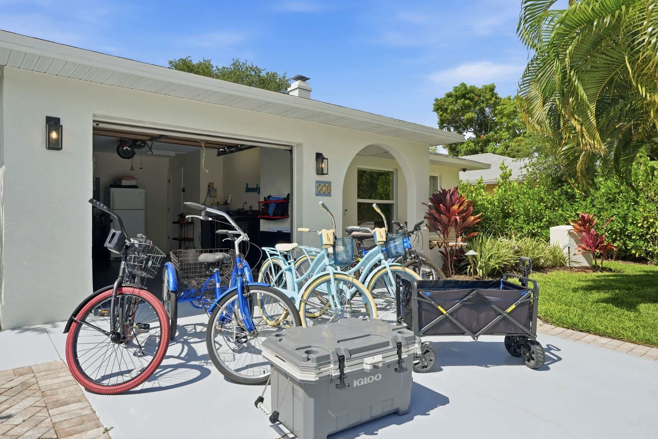 A garage with bicycles and a storage box.