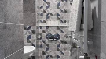 Shower, towels, soap, toilet paper