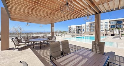 Bright and Modern Condo w/ Balcony, Shared Pool, A/c, Minutes to Beach & Town