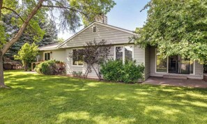 A single-story house with a front yard, a visible garage, and a large tree. - Carbondale Creekside Rancher - Fishing Access (Carbondale)