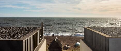 On the beach, sun-loungers