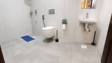 Bidet, towels, soap, toilet paper