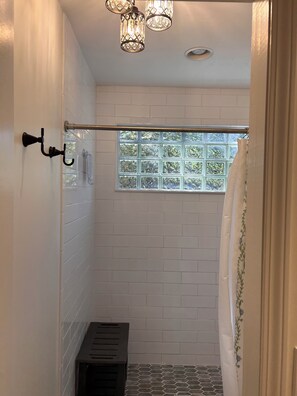 A shower with a window, a towel rack, and a vent. - Home with private pool near historic area and the beach in Fernandina Beach (Fernandina Beach)
