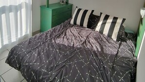 A bunk bed with a green frame, a bedside table with a lamp, and a window with sheer curtains. - Holiday Home in 'Port Aloès' Resort with Sea View, Shared Pool and Air Conditioning (Cerbère)
