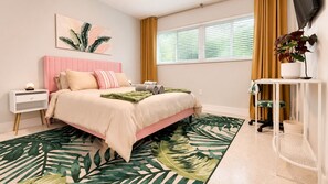 A bedroom with a bed, bedside table, nightstand, window, curtains, and a potted plant. - 12 Min to Beach - Karaoke Room, Pool & Games (North Miami Beach)