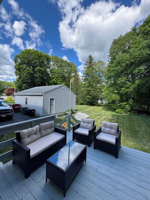 A deck with outdoor furniture, a covered grill, and a house in the background. - FIFA World Cup Stay. Near I-95 & Route 1 (North Attleborough)