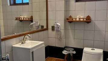 Deluxe Double Room | Bathroom | Hair dryer, towels, soap, shampoo