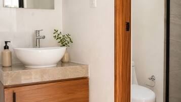 Shower, towels, soap, toilet paper