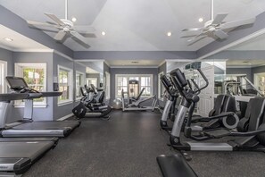 A gym with treadmills, elliptical machines, and free weights. - Las Colinas Retreat Near Toyota Music Factory, DFW & Convention Ctr (Irving)