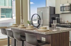 Fridge, microwave, oven, stovetop - Beautiful luxury high-rise condo with views of downtown Los Angeles in Koreatown (Vernon)