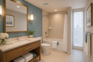 A bathroom with a double sink, toilet, bathtub, and shower. There is a window with blinds, a mirror with a cityscape, and a plant on the counter. - The Elowyn Hotel (Toronto)