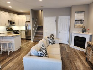 A modern kitchen with white cabinetry, a built-in microwave, and a stainless steel refrigerator. - Spacious 3 Bedroom 2 Full baths in Wildwood Crest. 3 Blocks from to the beach. (Wildwood)