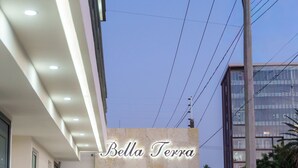 A building with a sign reading 'Bella Terra,' a modern architectural style, and a clear sky. - Bella Terra (Hermosillo)
