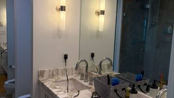 Separate bathtub and shower, hair dryer, slippers, towels