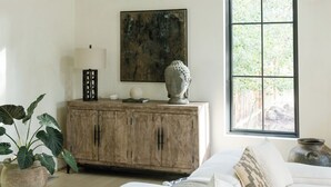 A bedroom with a bed, a wooden cabinet, a painting, and a window. - The Still House ~ Acreage · Hot Tub · Sauna · Gym (Bend)