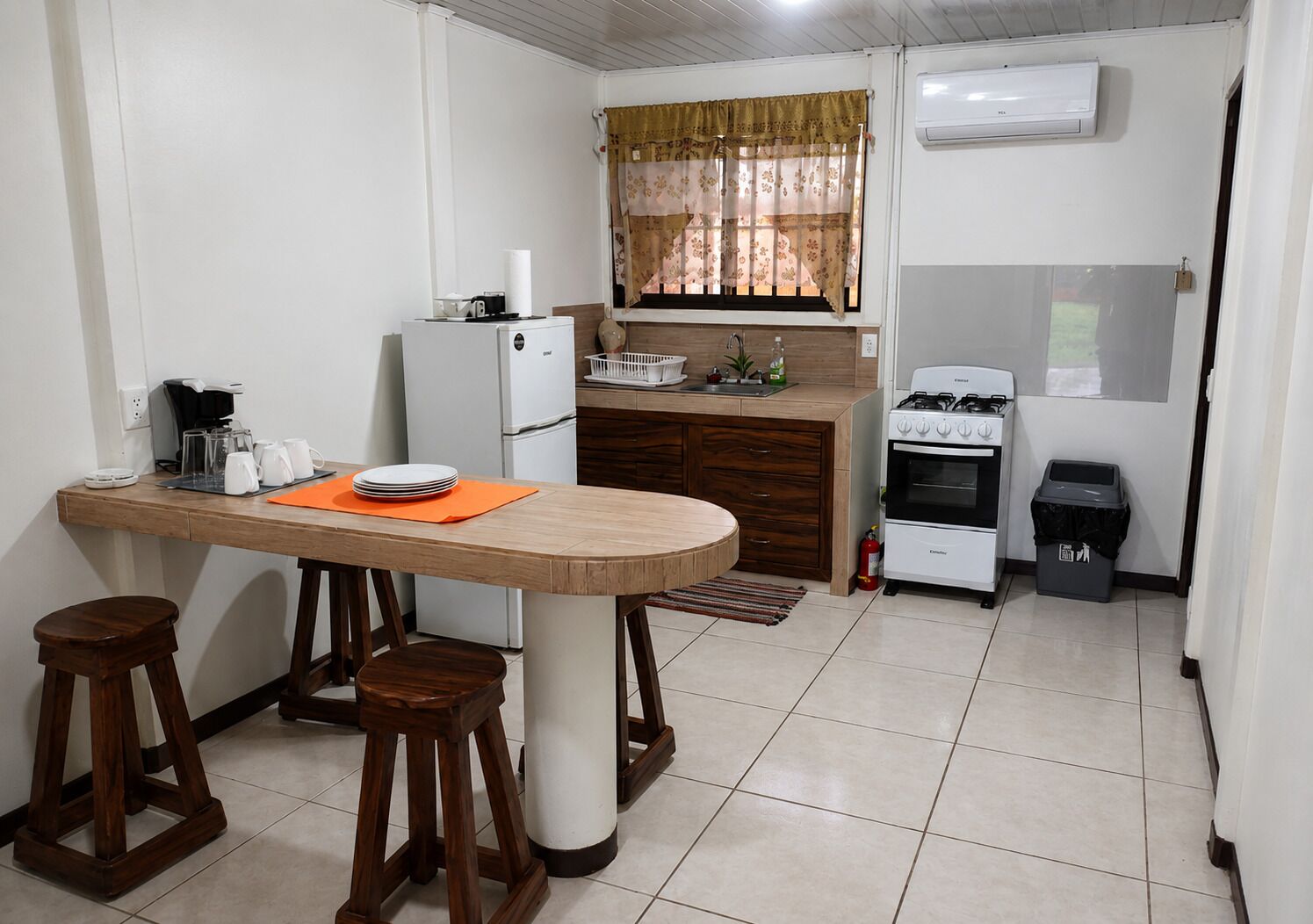 Fridge, stovetop, coffee/tea maker, cookware/dishes/utensils
