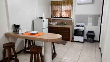 Fridge, stovetop, coffee/tea maker, cookware/dishes/utensils