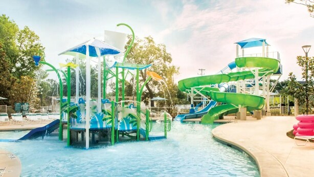 A water park with multiple slides and water features, including a wave pool and a lazy river. - Myrtle Beach Family Escape with Spacious 3BR Lockoff Resort Suite (Myrtle Beach)