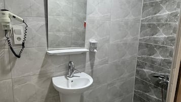 Hair dryer, towels, soap, shampoo