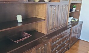 A wooden cabinet with multiple drawers and shelves. - SUNNY PARK FAMILY HOME with Largest Private Yard & Big Balcony Free WiFi & bikes (Velenje)