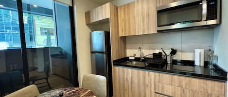 Fridge, microwave, stovetop, coffee/tea maker