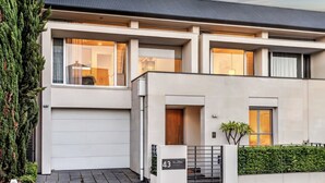 A modern two-story house with a garage, large windows, and a number '43' sign. - Margaret House | Elegant City-Fringe Escape (North Adelaide)