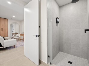 A modern bathroom with a shower, a toilet, and a sink. - 501 First #911 Prime Downtown Living (Miami)