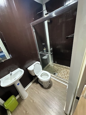 A bathroom with a toilet, sink, and shower. - La Macana Ecotour (Cacique)