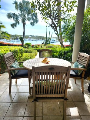 Outdoor dining - Waterfront Bliss in Paradise | Cozy Condo Near Beaches, Dining & More (The Bight Settlement)