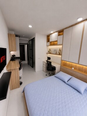 A modern bedroom with a bed, a desk, a chair, and a TV displaying 'NETFLIX'. - Modern loft in Chicó, close to the 93 park (Bogotá)