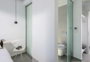 A modern bathroom with a glass partition, a toilet, and a control panel. - Luxury 2BR Cretan Villa Near Hersonissos Beaches (Hersonissos)