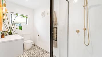 Shower, hair dryer, towels, soap
