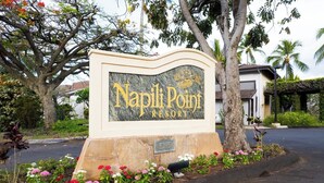 A sign for Napili Point Resort with a stone base and a marble plaque. - Napili Point 2 Water Front Villas, Sleeps 10 | Car Incl. w/ 6 nights | ML-4080 by KBM (Lahaina)