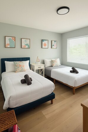 A hotel room with two beds, a desk, and a window with blinds. - 2 Beach Units for 6 | Patio + Free Parking (Hollywood)