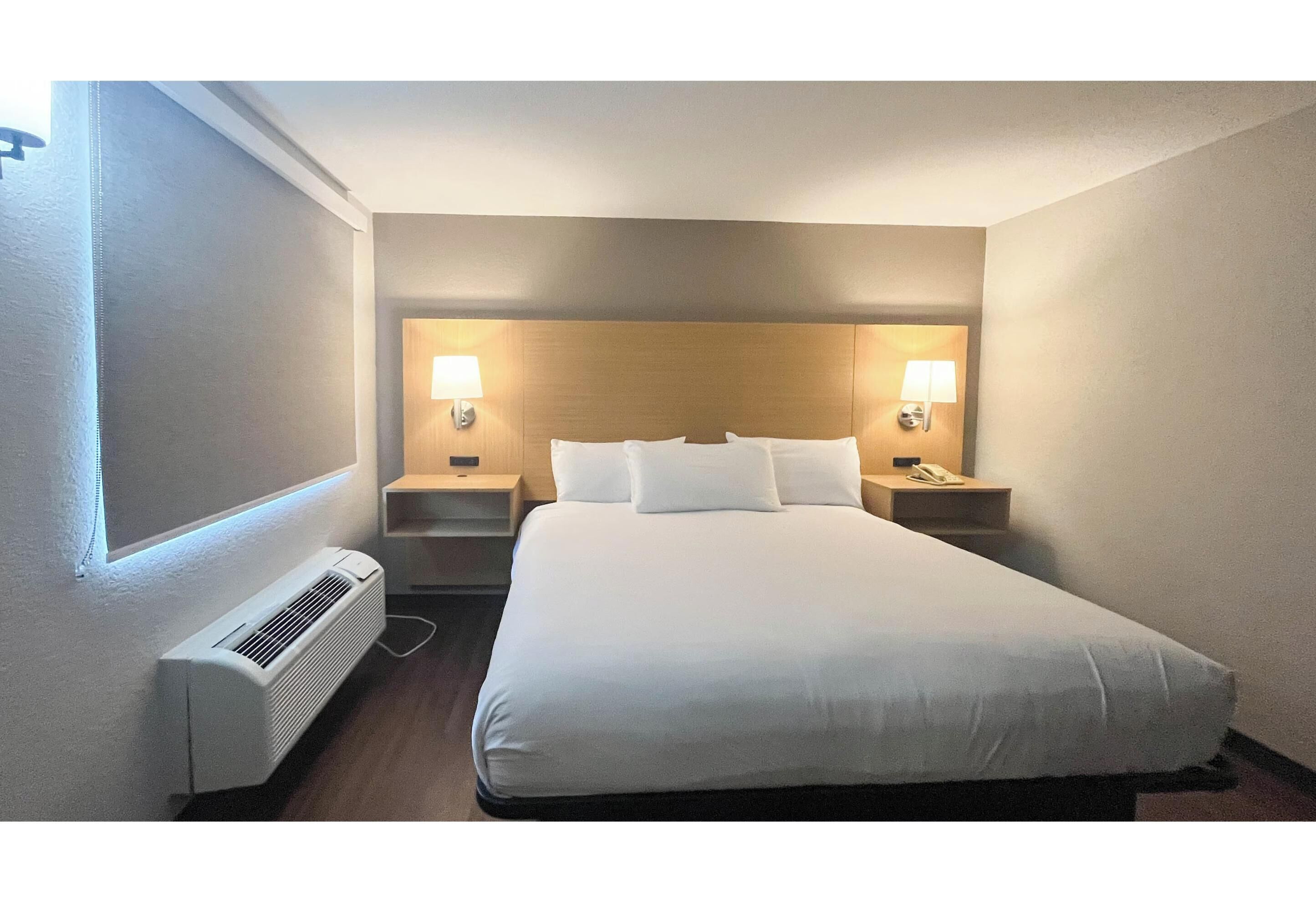 Premium bedding, desk, laptop workspace, blackout curtains