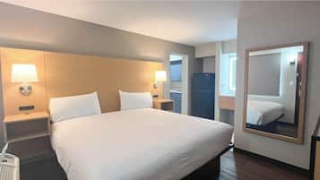 Premium bedding, desk, laptop workspace, blackout curtains