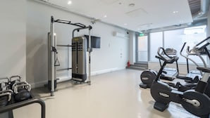 A gym with cardio machines, free weights, and a weight machine. - Student Only Livin (Cardiff)