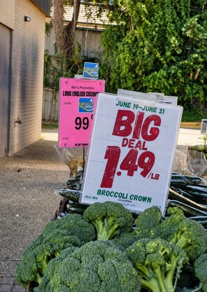 A display of broccoli with a promotional sign indicating a price of 1.49 per pound.