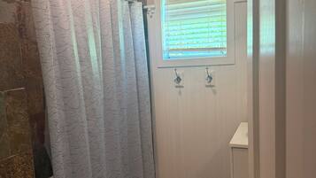 Townhome, City View | Bathroom | Separate tub and shower, free toiletries, hair dryer, slippers