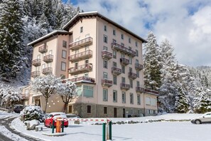 A multi-story hotel with balconies, surrounded by snow-covered trees. - Bel'Alp 24 Historical Residence Near Ski Lifts at Le Tour in Chamonix, Le Tour (Argentière), France (Le Tour (Argentière))