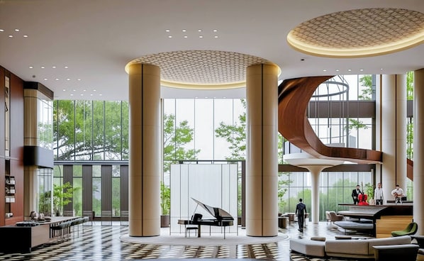 A spacious lobby with large columns, a grand piano, and a modern staircase. - Marqen Hotel (Jakarta)