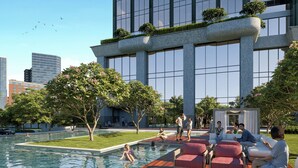Un bâtiment moderne doté d’une piscine, d’un espace extérieur aménagé et de verdure.