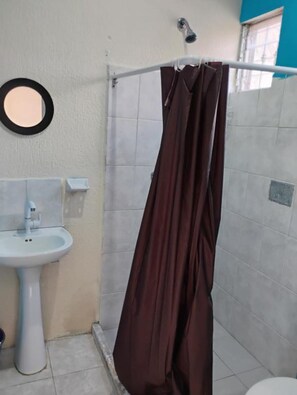 A bathroom with a white sink, a mirror, a shower curtain, and a window. - NICE VIEW HOUSE IN CANCUN (CANCUN)