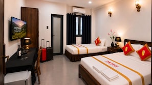 A hotel room with two beds, a desk, a TV, and a minibar. - The Rice Hotel - Ben Thanh (Ho Chi Minh City)