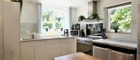 Microwave, stovetop, dishwasher, coffee/tea maker